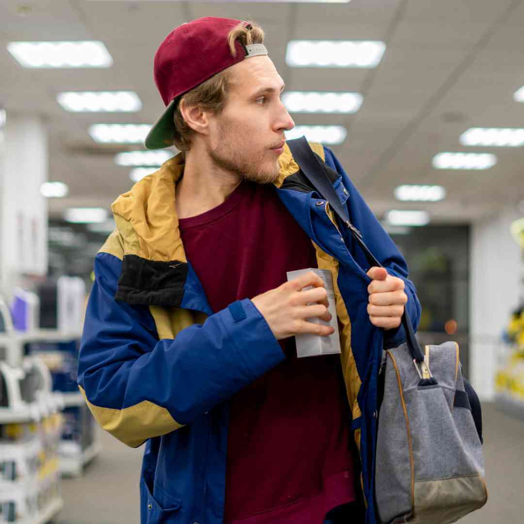 a man doing shoplifting